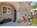 Inviting front porch with brick-paved patio and comfortable seating, great for relaxing and enjoying the neighborhood at 4772 E Portola Valley Dr # 102, Gilbert, AZ 85297