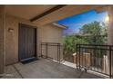 Exterior of the building with a private balcony, offering outdoor living space and neighborhood views at 5401 E Van Buren St # 3048, Phoenix, AZ 85008