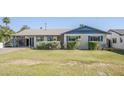 Well-maintained single-story home with a lush green lawn and desert landscaping at 5437 E Pinchot Ave, Phoenix, AZ 85018