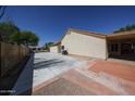 Spacious backyard featuring a concrete patio and stone landscaping, ideal for outdoor activities and gatherings at 5521 W Northwood Dr, Glendale, AZ 85310
