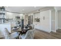 Cozy dining area with white cabinets, stainless steel appliances, and stylish decor at 7535 W Kimberly Way, Glendale, AZ 85308