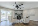 Inviting living room with a modern fireplace, accent chairs, and natural light at 7535 W Kimberly Way, Glendale, AZ 85308