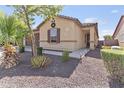 Charming single-story home with a two-car garage, desert landscaping and covered entry at 7575 W Darrel Rd, Laveen, AZ 85339