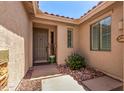 Close-up view of a charming front porch with stylish accents and a welcoming entrance at 7617 E Desert Honeysuckle Dr, Gold Canyon, AZ 85118
