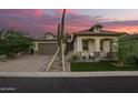 Beautiful single-Gathering home with desert landscaping, green grass, and a two-car garage at 8055 E Jaeger St, Mesa, AZ 85207