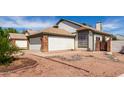 Charming home featuring a two-car garage, landscaped yard, and neutral exterior at 830 E Gila Ln, Chandler, AZ 85225