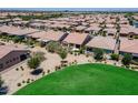 Aerial view of residential neighborhood and green common space at 841 E Farmers Ln, Queen Creek, AZ 85140