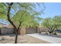Stucco two-story home with a well maintained desert landscape at 8438 W Bajada Rd, Peoria, AZ 85383