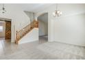 Bright, open living space featuring high ceilings, a staircase and modern finishes at 8438 W Bajada Rd, Peoria, AZ 85383