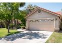 Single Gathering home featuring a two car garage and mature landscaping at 8896 E Mescal St, Scottsdale, AZ 85260