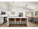 Spacious kitchen with modern appliances, a breakfast bar, and easy access to the dining area at 8896 E Mescal St, Scottsdale, AZ 85260