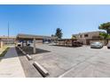 Community parking lot with covered parking spaces available for residents at 948 S Alma School Rd # 97, Mesa, AZ 85210
