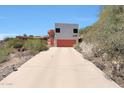 Contemporary home with private driveway and garage on a hillside lot at 9932 N 16Th E Pl, Phoenix, AZ 85020