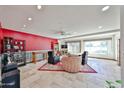 Spacious living room with comfortable seating, a large window, and tiled flooring at 1035 N Vista Verde --, Litchfield Park, AZ 85340