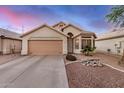 Charming single-story home featuring a two-car garage and well-maintained desert landscaping at 1060 W Dava Dr, Tempe, AZ 85283