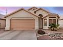 Charming single-story home with a two-car garage and beautiful desert landscaping at 1060 W Dava Dr, Tempe, AZ 85283