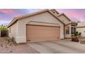 Single-story home with a two-car garage and low-maintenance landscaping at 1060 W Dava Dr, Tempe, AZ 85283
