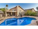 Beautiful backyard with swimming pool and lounge chairs that's perfect for entertaining at 1060 W Dava Dr, Tempe, AZ 85283