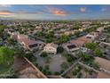 Aerial view of a residential neighborhood with well-maintained homes and lush green landscaping at 14267 W Crocus Dr, Surprise, AZ 85379