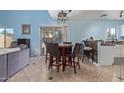 Cozy dining area with seating for four, adjacent to the kitchen and overlooking the backyard at 17851 W Calavar Rd, Surprise, AZ 85388
