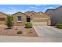 Attractive single-story home with desert landscaping, showcasing its curb appeal and tidy front yard at 21582 W Cocopah St, Buckeye, AZ 85326