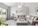 Inviting living area with vaulted ceilings, ample natural light, and decorative art at 2444 S Noche De Paz --, Mesa, AZ 85202