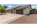 This home features an attached two car garage and beautiful desert landscaping at 2616 S El Dorado --, Mesa, AZ 85202