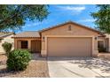 Charming single-story home featuring a two-car garage and low-maintenance desert landscaping at 30212 N Sunray Dr, San Tan Valley, AZ 85143