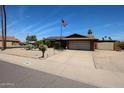 Inviting single-story house boasts desert landscaping, solar panels, and a convenient two-car garage at 3848 W Kings Ave, Phoenix, AZ 85053