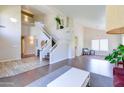 Spacious living room with lots of natural light, an open staircase, and views to other living spaces at 3921 W Jasper Dr, Chandler, AZ 85226