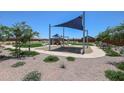 Community park with a shaded playground, offering a fun and safe environment for children to play at 39985 W Sparks Ln, Maricopa, AZ 85138