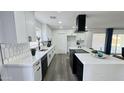 Bright kitchen with an island, countertops and appliances, complete with tile backsplash and modern finishes at 4125 W Villa Rita Dr, Glendale, AZ 85308
