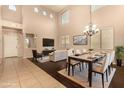 Open floor plan with hardwood floors, chandelier, and a dining table at 9207 W Kirby Ave, Tolleson, AZ 85353