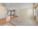 Bright and airy living room features hardwood floors, plush carpet, and a cozy window seat at 987 E Divot Dr, Tempe, AZ 85283