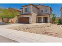 Charming two-story home with a well-manicured yard and a two-car garage at 10009 W Bloch Rd, Tolleson, AZ 85353