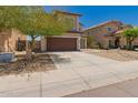 Charming two-story home with a well-manicured yard and a two-car garage at 10009 W Bloch Rd, Tolleson, AZ 85353