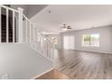 Spacious living room featuring modern floors, neutral paint, and lots of natural light at 10009 W Bloch Rd, Tolleson, AZ 85353