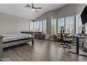Bright main bedroom features vaulted ceilings, wood floors, a seating area, and multiple windows at 1244 W Straford Ave, Gilbert, AZ 85233