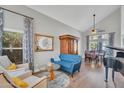 Bright living room featuring vaulted ceilings, wood floors, and stylish, modern decor at 1264 S Sierra St, Gilbert, AZ 85296