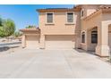 Spacious three-car garage and long concrete driveway at 15985 W Bartlett Ave, Goodyear, AZ 85338