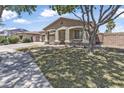 Attractive house showcasing desert landscaping, and an attached garage at 18998 E Lark Dr, Queen Creek, AZ 85142