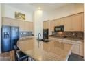 Modern kitchen with granite countertops, stainless steel appliances, and ample cabinetry at 2041 E Palm Beach Dr, Chandler, AZ 85249