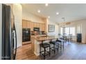 Well-equipped kitchen features an island with stools, modern appliances, and sleek finishes at 2041 E Palm Beach Dr, Chandler, AZ 85249