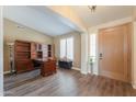 Open living room with wood floors, neutral tones, and front door at 2041 E Palm Beach Dr, Chandler, AZ 85249