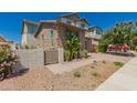 A charming home with a brick facade and desert landscaping adds character to the property at 22682 E Indiana Ave, Queen Creek, AZ 85142