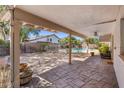 Covered back patio with stamped concrete flooring, ceiling fan, and backyard views at 2755 W Calle Del Norte --, Chandler, AZ 85224