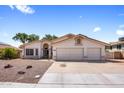 Inviting single-Gathering home showcasing a tile roof, desert landscaping, and a two-car garage at 2755 W Calle Del Norte --, Chandler, AZ 85224