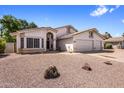 Charming single-Gathering home featuring desert landscaping, a tile roof, and a two-car garage at 2755 W Calle Del Norte --, Chandler, AZ 85224