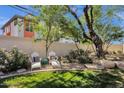 Backyard view with trees, desert landscaping and seating at 3221 N 37Th St # 10, Phoenix, AZ 85018