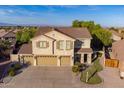 Aerial view of a two-story home with a three-car garage and manicured front and side yards at 32311 N Cat Hills Ave, San Tan Valley, AZ 85144
